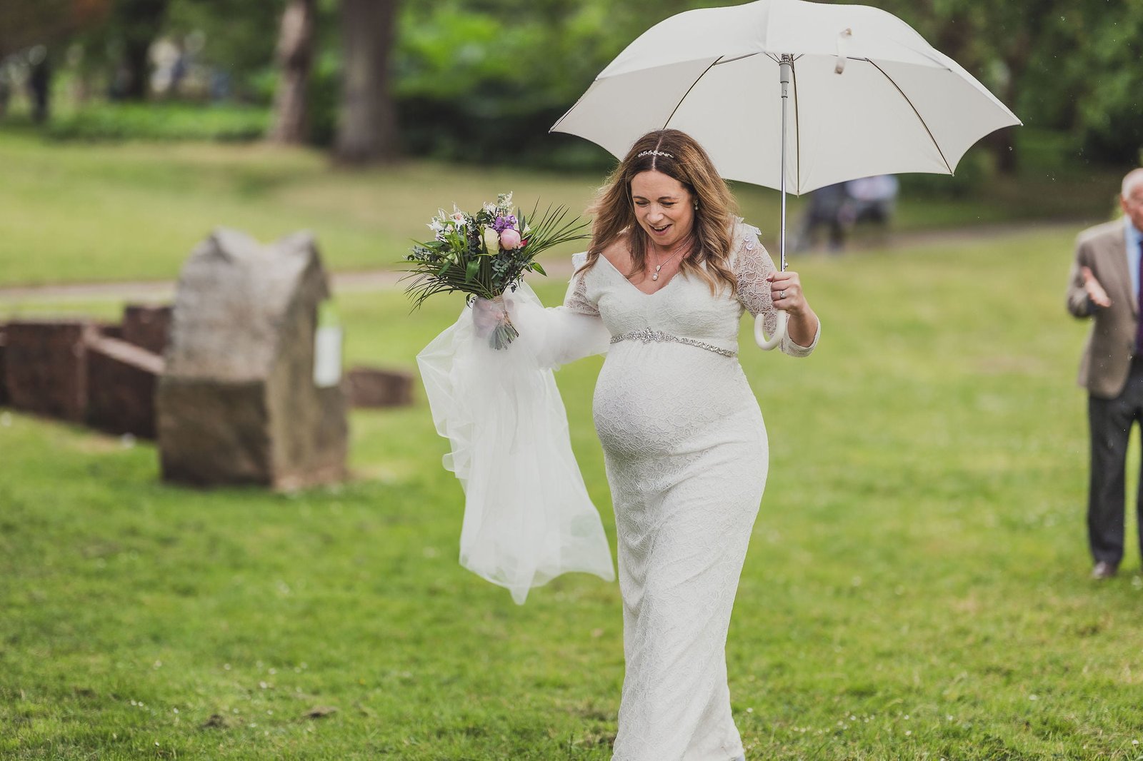 Bride with boquet and umbrella