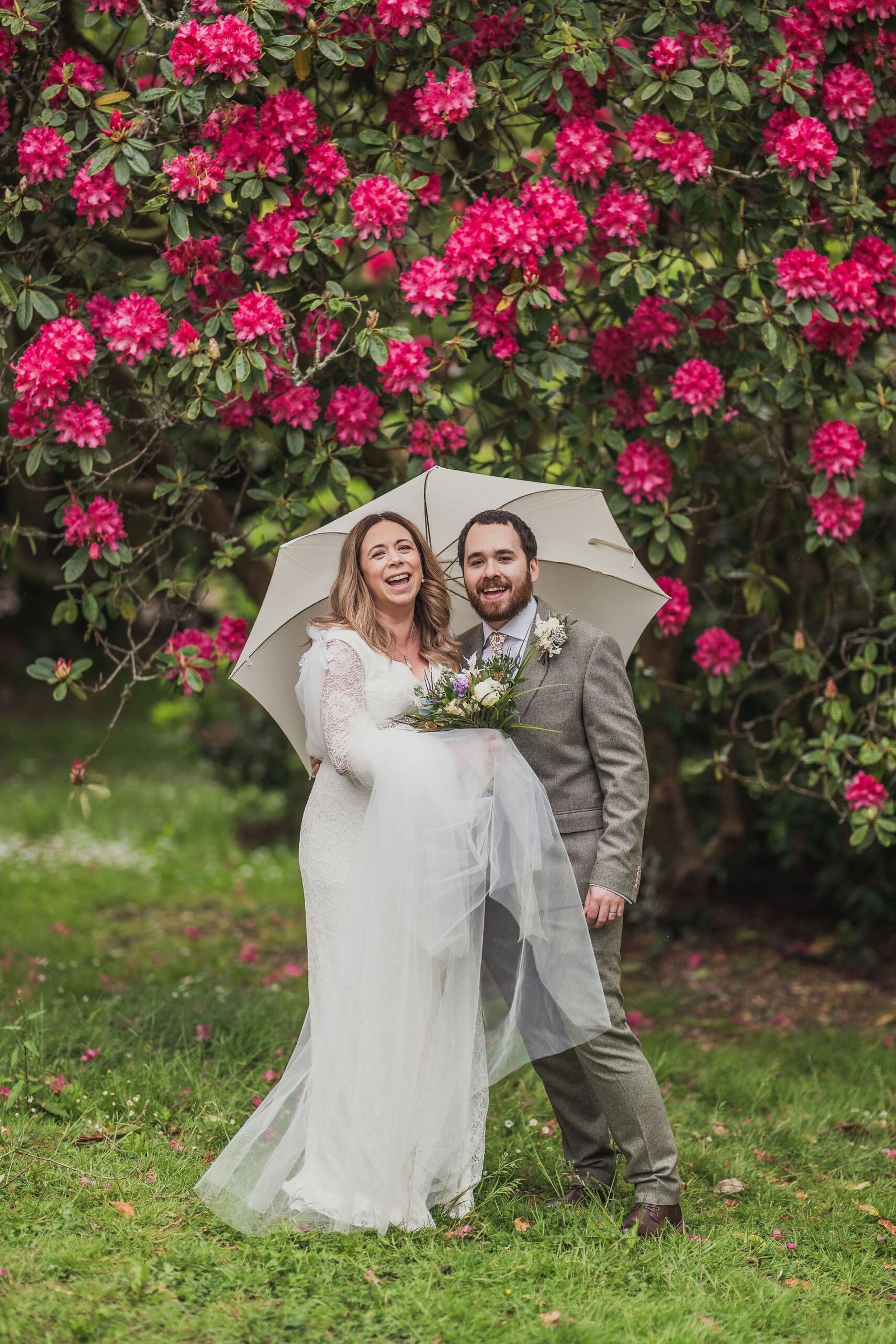 Bride and Groom with pink flowers