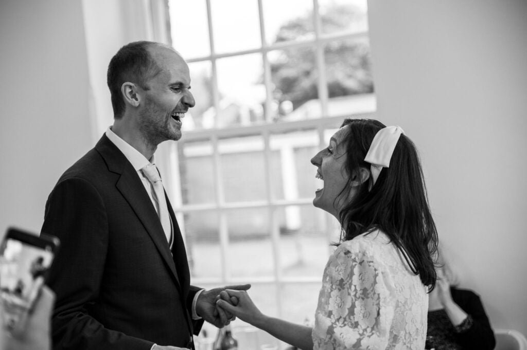 Laughing bride and groom