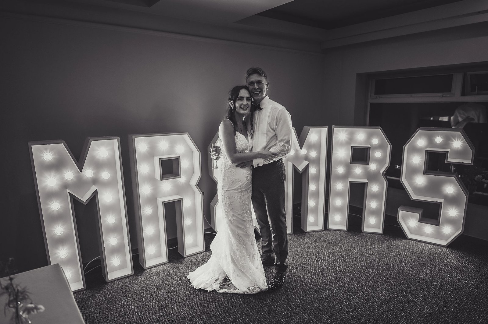 Bride and Groom in front of Mr and Mrs letters